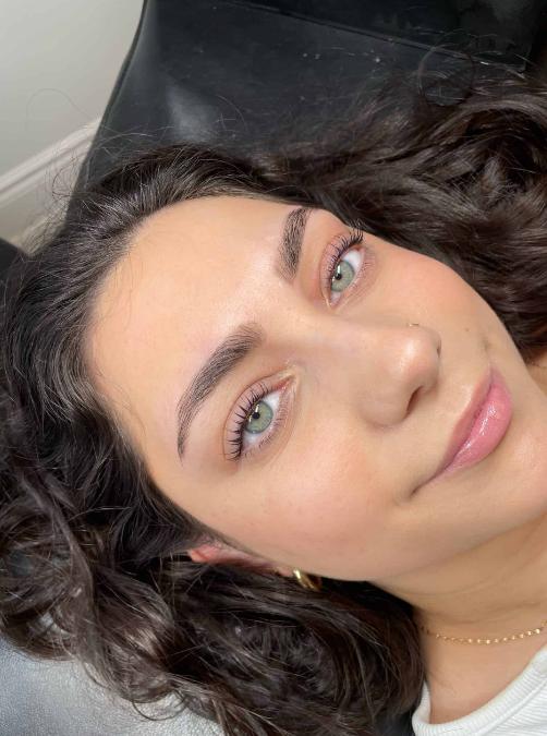 A woman after getting a lash lift and tint.